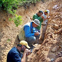 Examining and logging a fresh trench at the Akarca gold-silver project, Turkey; from front to back: Dr. Dave Johnson, Chief Geologist, Mike Sheehan, Exploration Manager-Turkey, Halil Aydincak, Sr Geologist & Alper Ozbek,Geologist